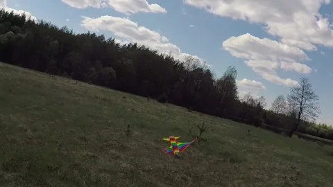 The rotation and fall of the kite on the ground. Stock Footage