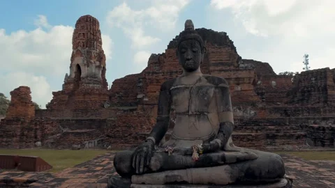 Rotation around a old statue of Buddha - Ayutthaya, Thailand Stock Footage 176157930