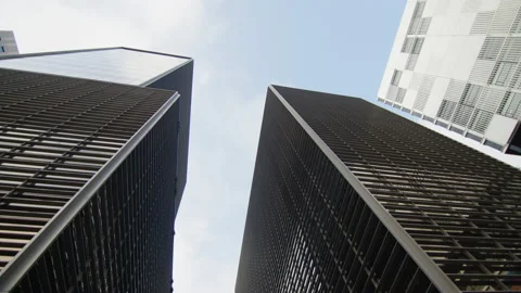 Rotation around two modern buildings with windows, in a business district Stock Footage 220659173