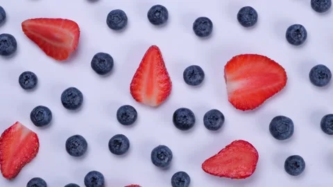 Rotation background of blueberries, strawberries, on a white background Stock Footage 202137350