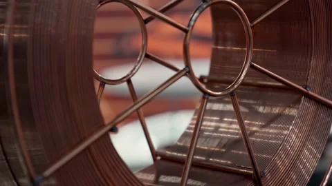 Rotation of bobbin with copper wire for welding. Stock Footage 163473307
