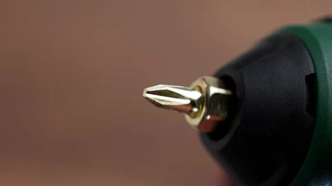 Rotation of a brass screwdriver bit Stock Footage 345414149