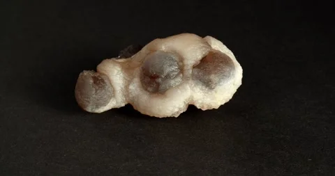 Rotation of chalcedony Morocco. Close-up on a black background. Video stock 167255535