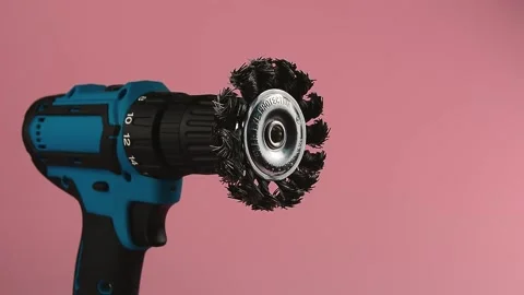Rotation of the cleaning brush in the head of a hand-held screwdriver Stock Footage 135319196