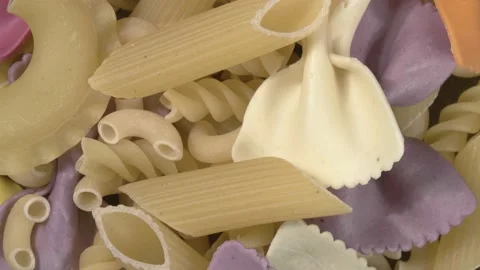 Rotation of close-up pasta. Assorted pasta. Pre-finished for cooking. Video stock 143729387