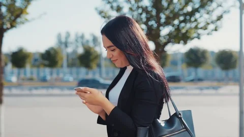 Rotation close up view of cheerful young businesswoman in stylish black suit Stock Footage 114245016