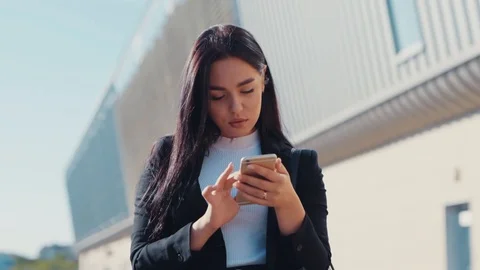 Rotation close up view of good looking young brunette businesswoman actively Stock Footage 114245034