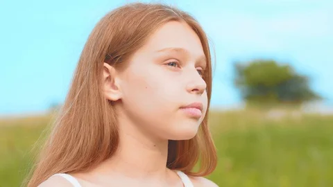 Rotation close up view portrait of beautiful little teenage girl with charming Stock Footage 113045703