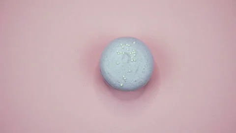 ROTATION: A Colorful Macaroons are rotating on a pink background Stock Footage 87189959