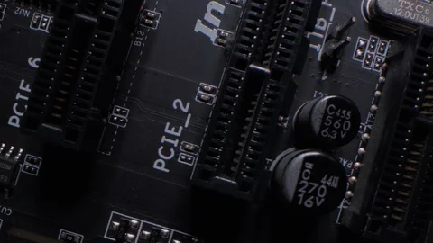 Rotation of computer circuit board with microprocessor, battery, slots. Close up Stock Footage 106639854