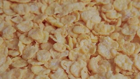 Rotation of crispy yellow corn flakes Stock Footage 99810634