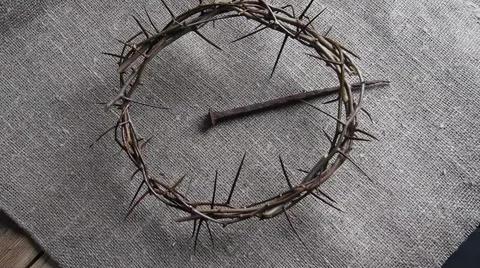 Rotation on crown of thorns and large nail on burlap. Stock Footage 67186545