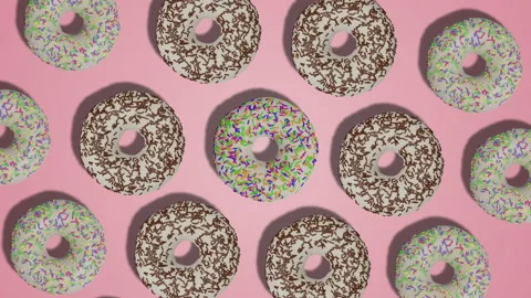 Rotation of delicious glazed donuts with colorful sprinkles on pink background Stock Footage 196484792