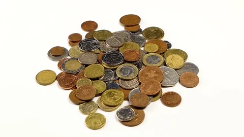 Rotation of different coins on the table Stock Footage 82484931