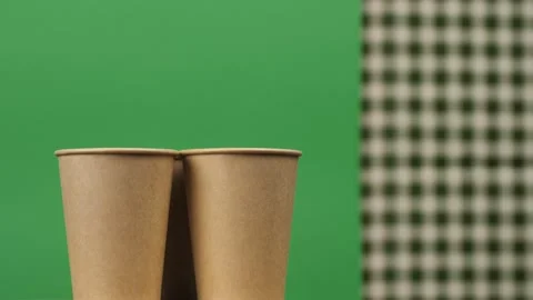 Rotation of disposable cups for coffee, tea, hot chocolate or any other drink on Stock Footage 249157330