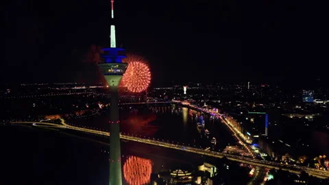 Rotation drone shot around Tower Düsseldorf with spectacular fireworks. (2) 스톡 동영상 220338614