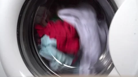 Rotation of the drum with things in the washing machine 4K Video stock 169139285