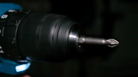 Rotation of an electric drill with screwdriver in slow motion. Stock Footage 240579503
