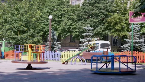 Rotation of an Empty Multicolored Carousel on a Playground in a City Park. Zoom 動画素材 158884845