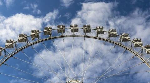 Rotation of ferris wheel with clouds on background. Stock Footage 65239946