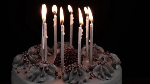 Rotation festive cake, with burning silver candles on black background. close up Stock Footage 278032933