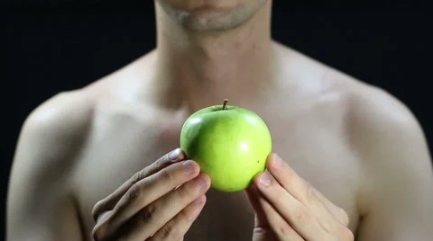 Rotation of a green apple between her hands Stock Footage 66510004