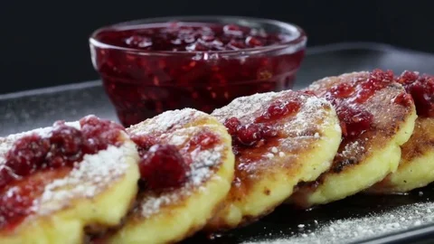 Rotation healthy homemade cheese pancakes with raspberry jam . Close up Stock Footage