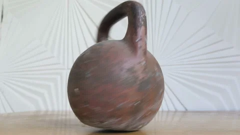 The rotation of the kettlebell for strength training on the table Stock Footage 108306736