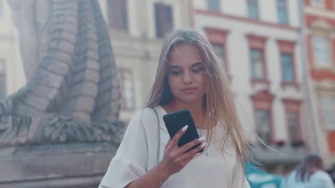 Rotation low angle shot of gorgeous young blonde woman standing by the Video stock 112673220