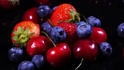 Rotation of mixed berries: strawberry, cherry, blueberry in 4K 스톡 동영상 77682638