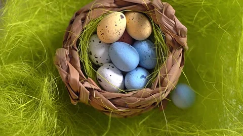 Rotation nest with easter  colorful eggs on green grass background Stock Footage 150380331