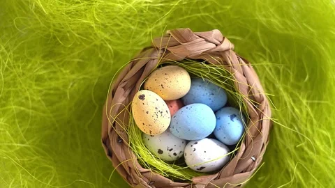 Rotation nest with easter  colorful eggs on green grass background Stock Footage 150380375