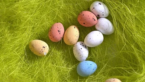 Rotation nest with easter  colorful eggs on green grass background Stock Footage 150380503