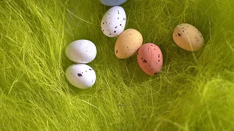 Rotation nest with easter  colorful eggs on green grass background Stock Footage 150380525