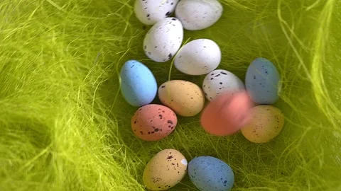 Rotation nest with easter  colorful eggs on green grass background Stock Footage 150380608