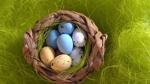 Rotation nest with easter  colorful eggs on green grass background Stock Footage 150380702