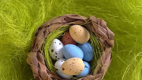 Rotation nest with easter  colorful eggs on green grass background Stock Footage 150380707