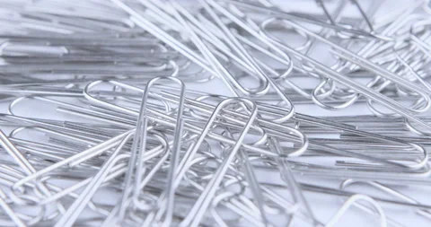 Rotation of paper clips on the white background Stock Footage 114306088