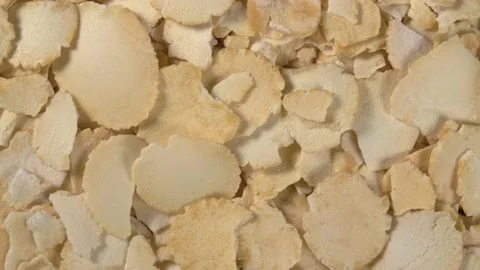 Rotation of pea flakes close-up. Fast-cooked pea porridge. Stock Footage 143786181