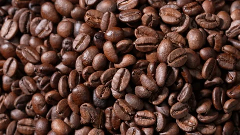 Rotation of pile roasted coffee beans. Видео 177536064