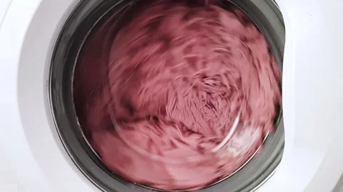 The rotation of a pink fluffy plaid in a white washing machine Stock Footage 241887826