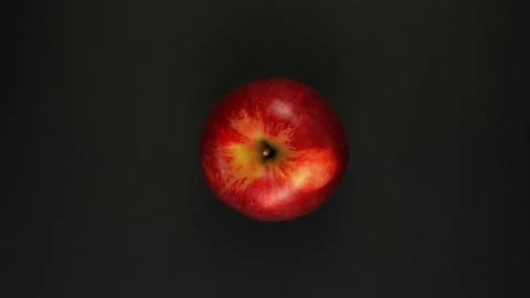Rotation red apple on a black background. Stock Footage 166741569
