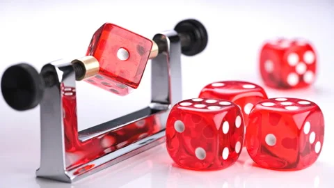 Rotation of the red dice on a special device balancer to check the correct shape Stock Footage 86191108