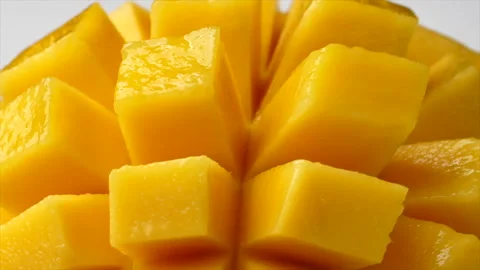 Rotation of rip mango slice cubes cut Stock Footage 152749210