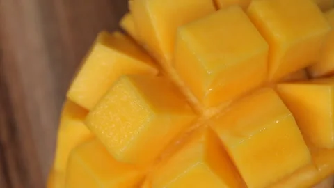 Rotation of rip mango slice cubes cut Stock Footage 263466454