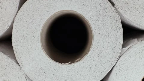 Rotation of rolls of white soft multi-layered toilet paper, , top view. flat lay Stock Footage 226828386