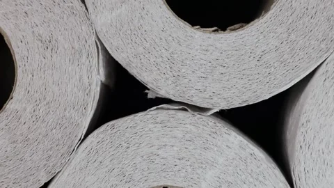 Rotation of rolls of white soft multi-layered toilet paper, top view. flat lay Stock Footage 226830580