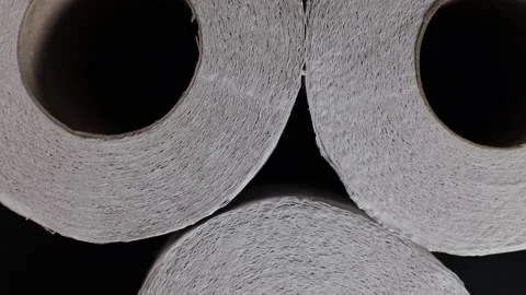 Rotation of rolls of white soft multi-layered toilet paper, , top view. flat lay Stock Footage 226830602