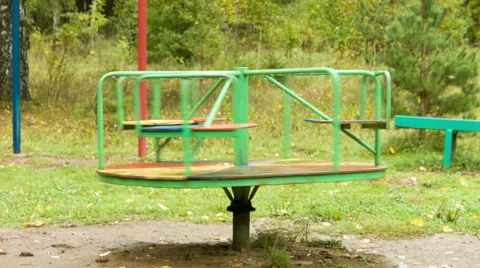 Rotation of a roundabout in the rain Stock Footage 45178464