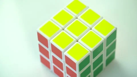 Rotation of the Rubik's Cube puzzle on a light background Stock Footage 246713704